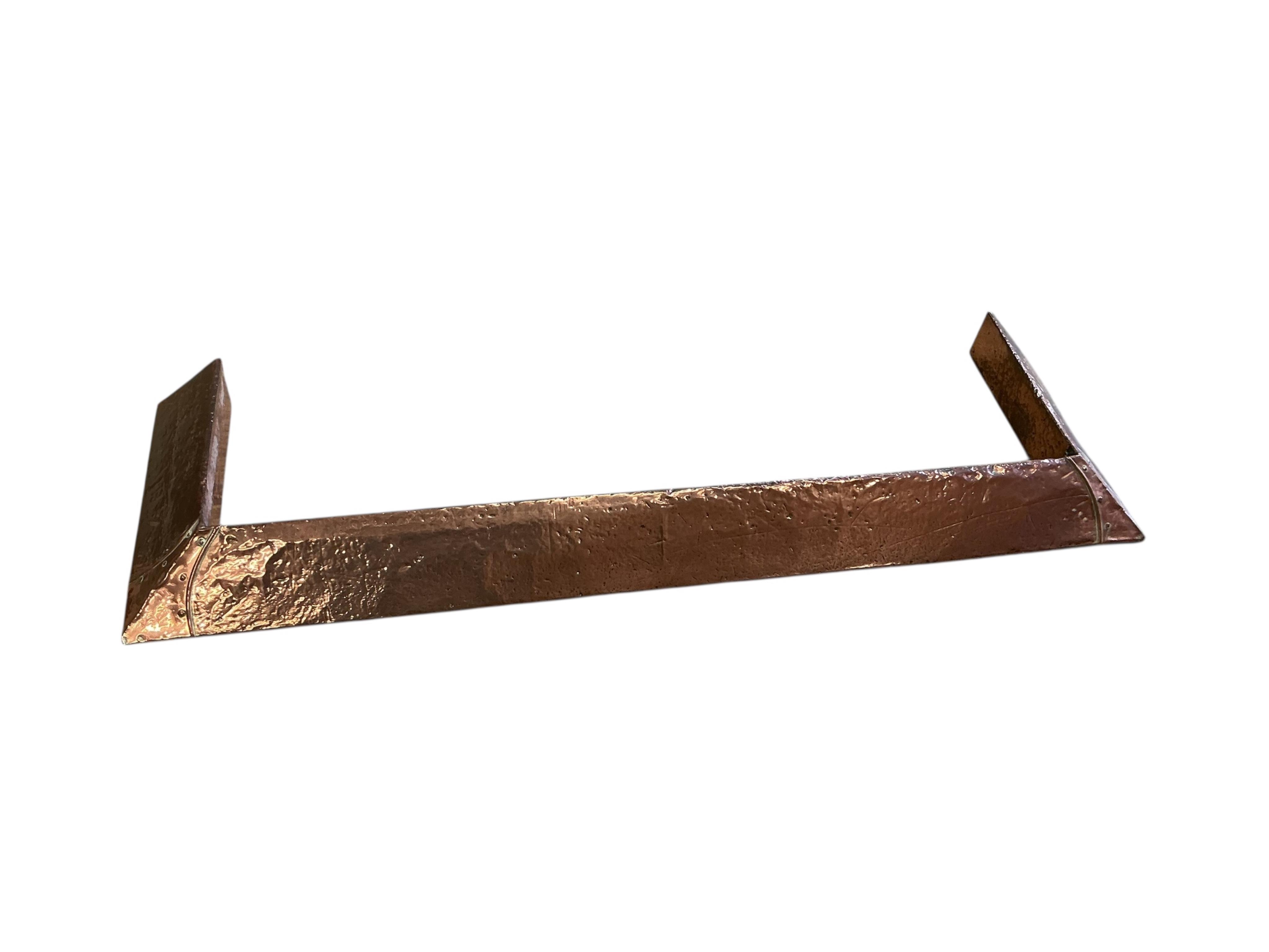 A Victorian copper kettle, a spouted bucket, two fire irons and a copper fender